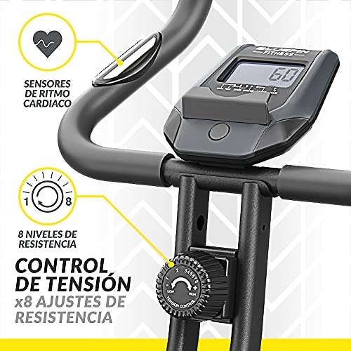 Bicicleta Estática Tour XP de Bluefin Fitness / Fitness en Casa / Estructura de Acero / Plegable / 8 Niveles de Resistencia / Sensores de Ritmo Cardiaco / App Kinomap / 5 Años de Garantía / LCD