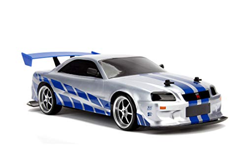 Jada Toys Fast & Furious RC Nissan Skyline GTR R34 - Coche teledirigido con Mando a Distancia, tracción a Las 4 Ruedas, función de Carga USB, Escala 1:10, Color Azul y Plateado