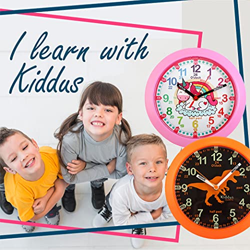 Kiddus Reloj Pedagógico para Niñas y Niños. De Pared, Analógico. Aprende la Hora con Nuestro Fácil Sistema Time Teacher. Ejercicios Incluídos. Mecanismo Silencioso. Manillas en Inglés. Dino