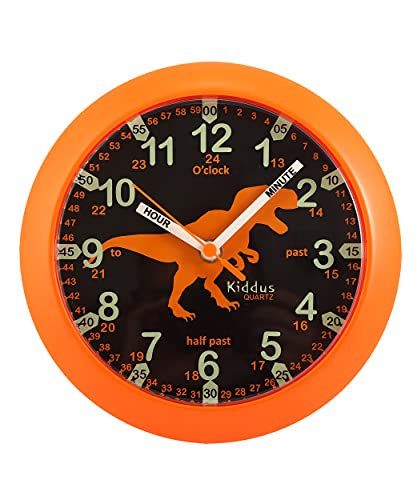 Kiddus Reloj Pedagógico para Niñas y Niños. De Pared, Analógico. Aprende la Hora con Nuestro Fácil Sistema Time Teacher. Ejercicios Incluídos. Mecanismo Silencioso. Manillas en Inglés. Dino