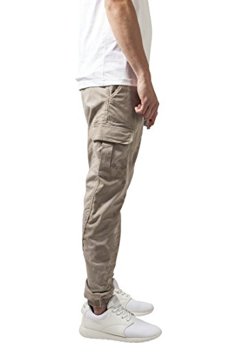 URBAN CLASSICS Pantalón jogging Camo Cargo con bolsillos de parche laterales y traseros, ajuste holgado, estampado camuflaje, cintura cordón, puños elásticos, color Beige Camo, talla 32